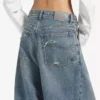Baggy-jeans for kvinner med lav skritt i skitten vintageblå