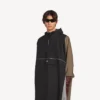 Teknisk poncho for menn i svart